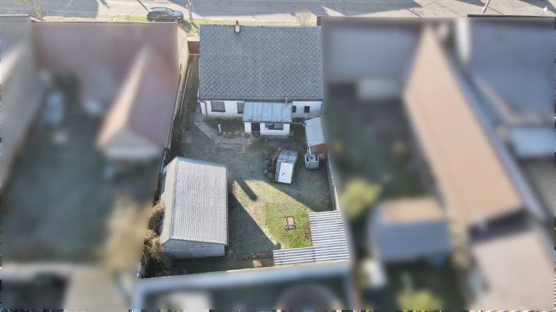 A top-down view of a family house with a yard on SNP Street in Veľké Leváre.