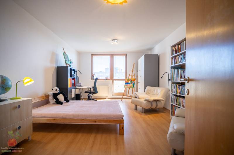 Children's room with a bed, desk, chair, and shelf in a 3-room apartment.