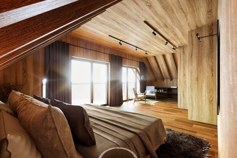 A room with large windows, wooden walls, and a floor with a wooden decor. House construction.