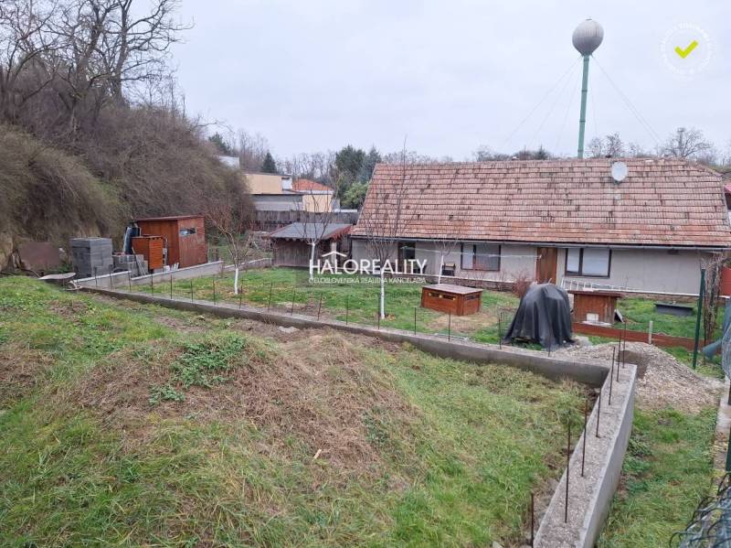 Family house in Brestovany with extensive garden land and a shelter for garden tools.