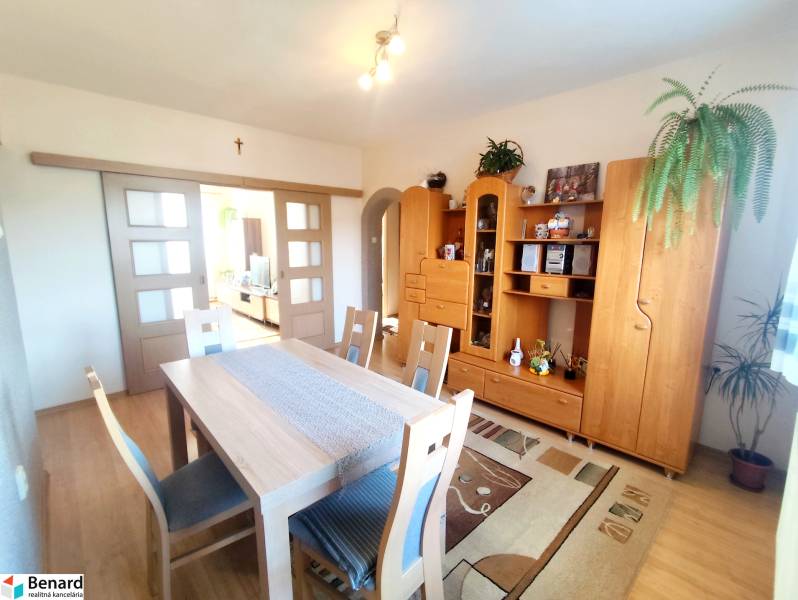 Interior of a 3-room apartment with wooden furniture and flooring with a wooden decor.