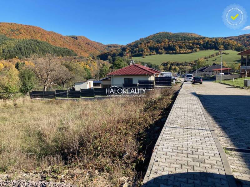 Plots - housing in Kľačno, with a view of picturesque autumn hills and village buildings.