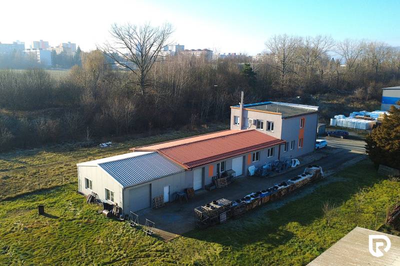 Production facilities on Továrenská Street in Dubnica nad Váhom, surrounded by greenery and buildings.