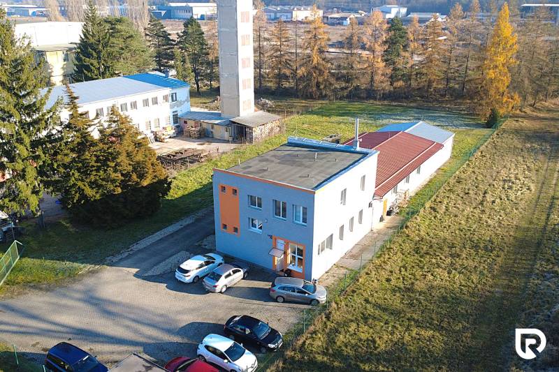 Production facilities on Továrenská Street in Dubnica nad Váhom, buildings surrounded by greenery.