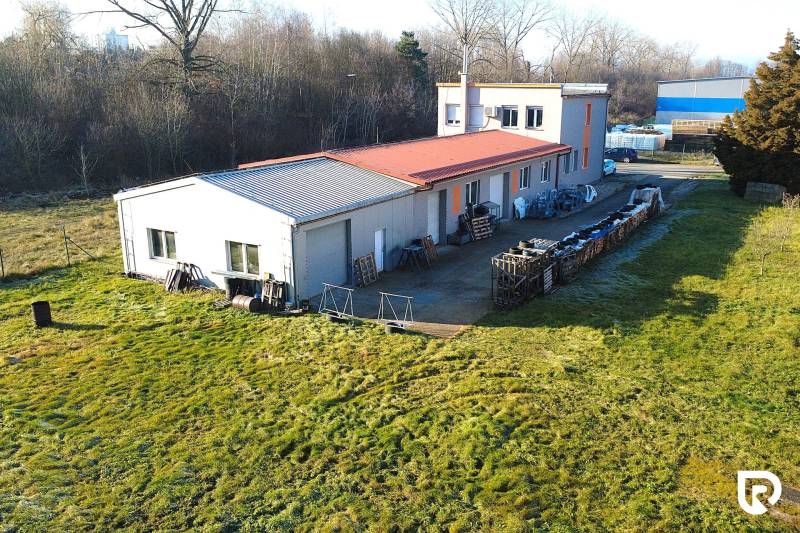 Production premises on Továrenská Street in Dubnica nad Váhom surrounded by greenery.