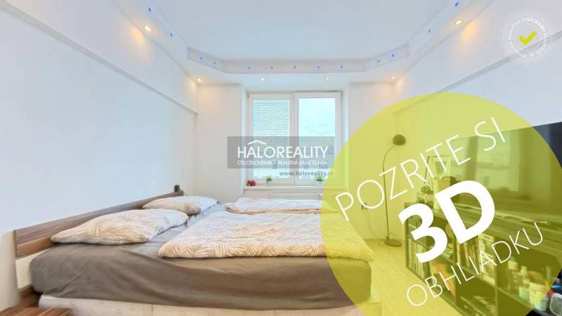 Bedroom in a 2-room apartment with a double bed and a large window.