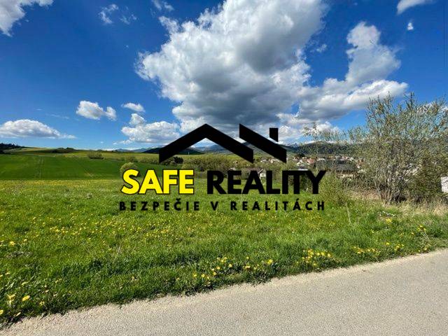 Beautiful green residential plots in Kotrčiná Lúčka under a blue sky with clouds.