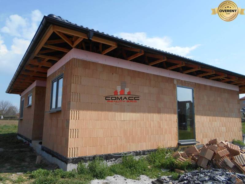 A family house in Nové Mesto nad Váhom, showing a construction site with a brick facade.