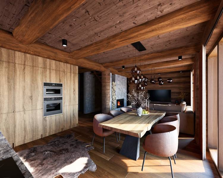 Interior of house construction with wood-patterned flooring, wooden beams, and a fireplace.