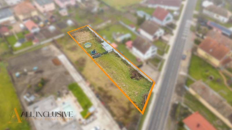 A residential plot in Jahodná with a garden and access to the road.