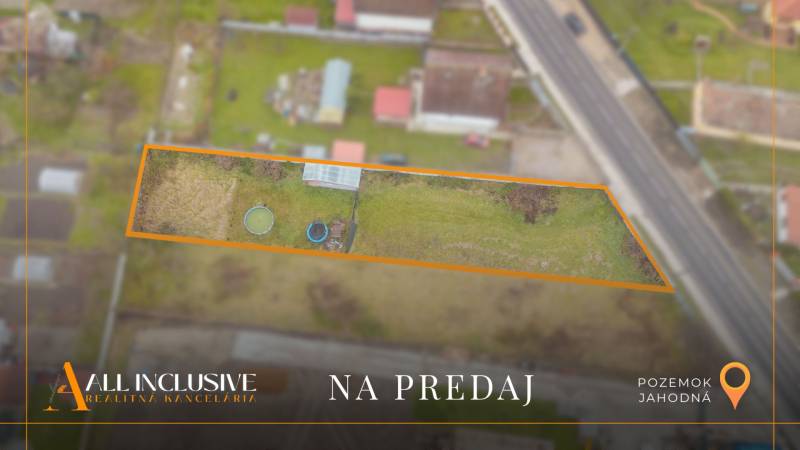 Offered residential land in Jahodná near the road with a grassy area.