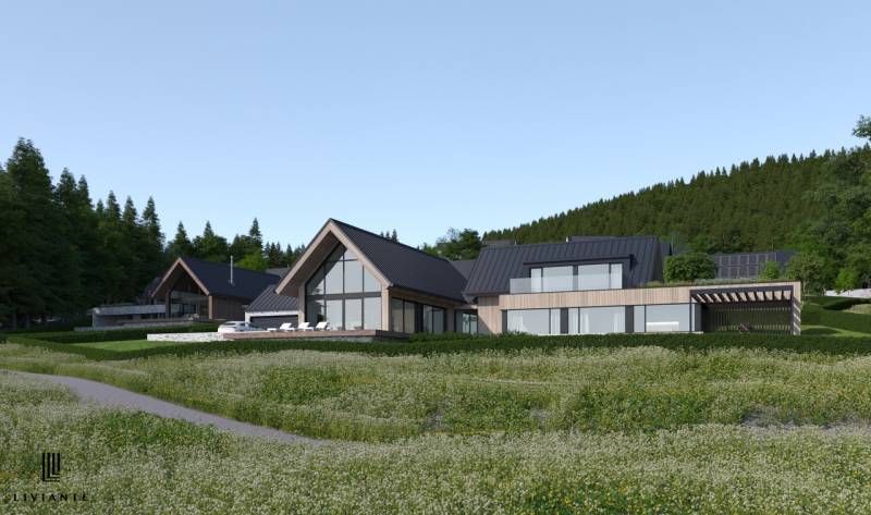 Modern buildings surrounded by nature in development plots near Tajov.
