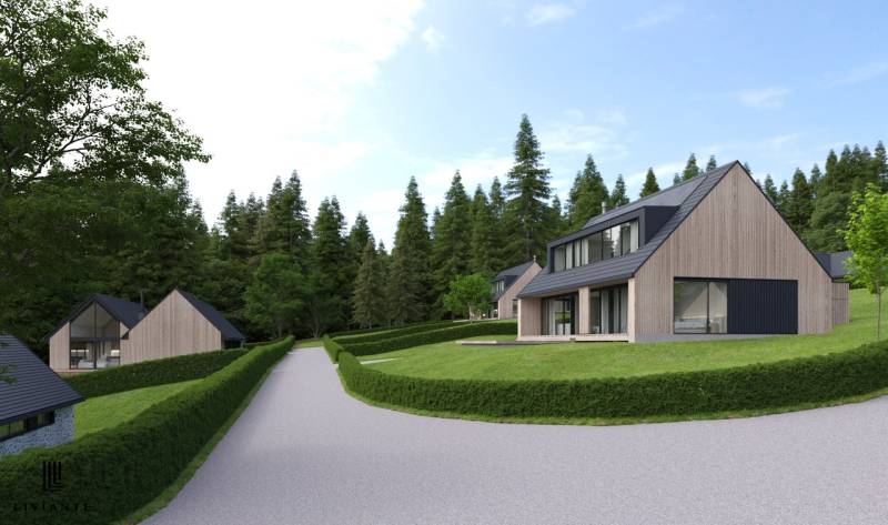 Development plots in Tajov with modern houses and surroundings full of greenery and forests.