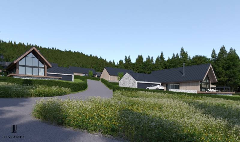 Development plots in Tajov with houses surrounded by nature and forest.
