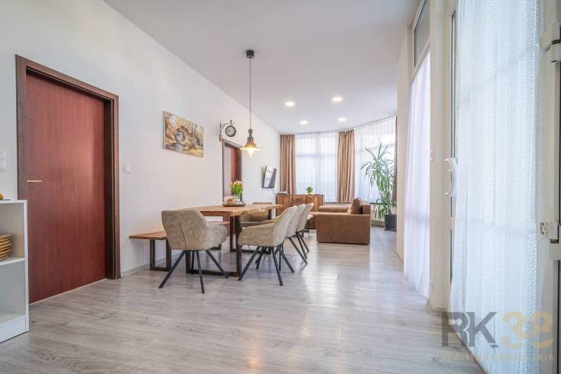 Stylish living room with dining area, bright spaces with furniture in a 4-room apartment.