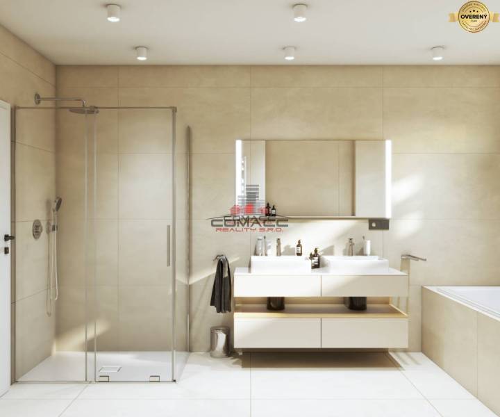 A bathroom with a bathtub and a shower in a family house. Light tiles and a double sink.