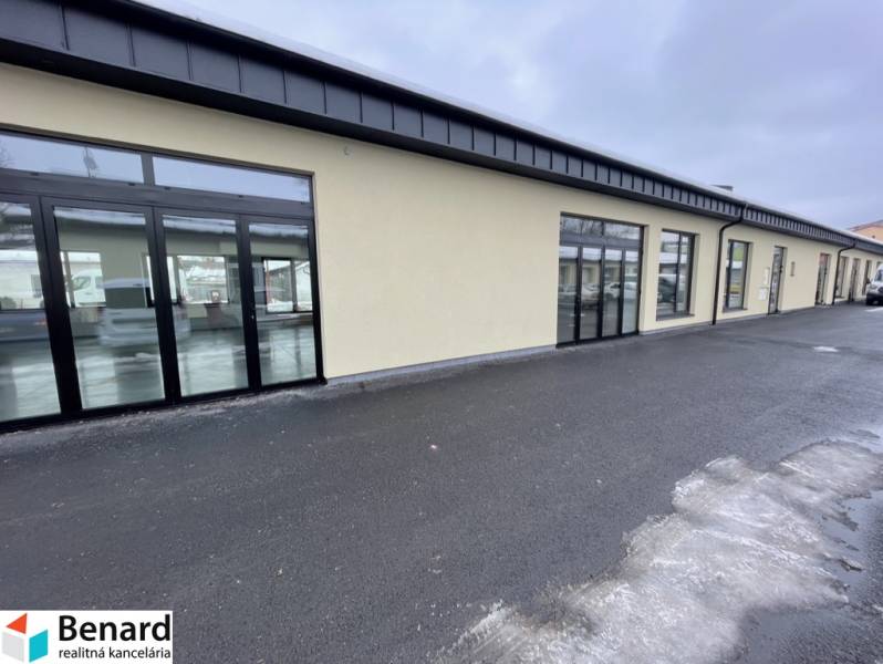 Commercial premises on Jarmočná Street in Stará Ľubovňa with glass display windows and a parking lot.