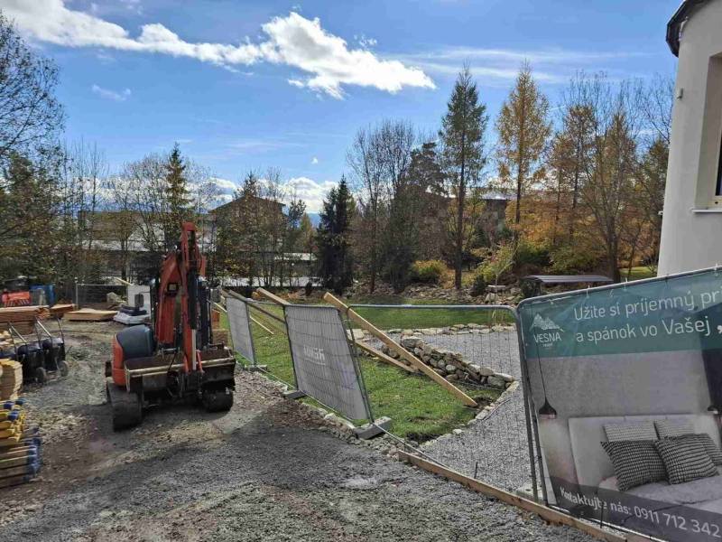 Construction site of a recreational apartment in Starý Smokovec with a view of the autumn landscape.