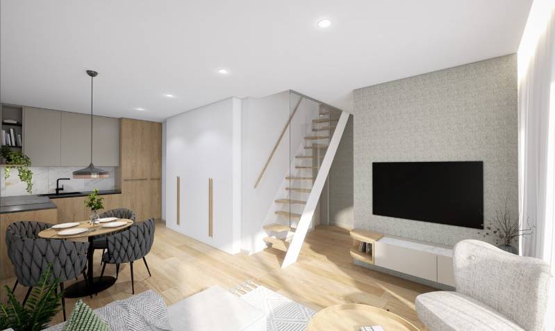 Recreational apartment with a kitchen, dining table, and staircase, floor with wooden decor.