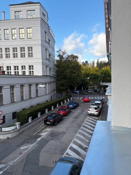 Street in Bratislava - Old Town, Cukrová with cars and a building on the edge of a 2-room apartment.