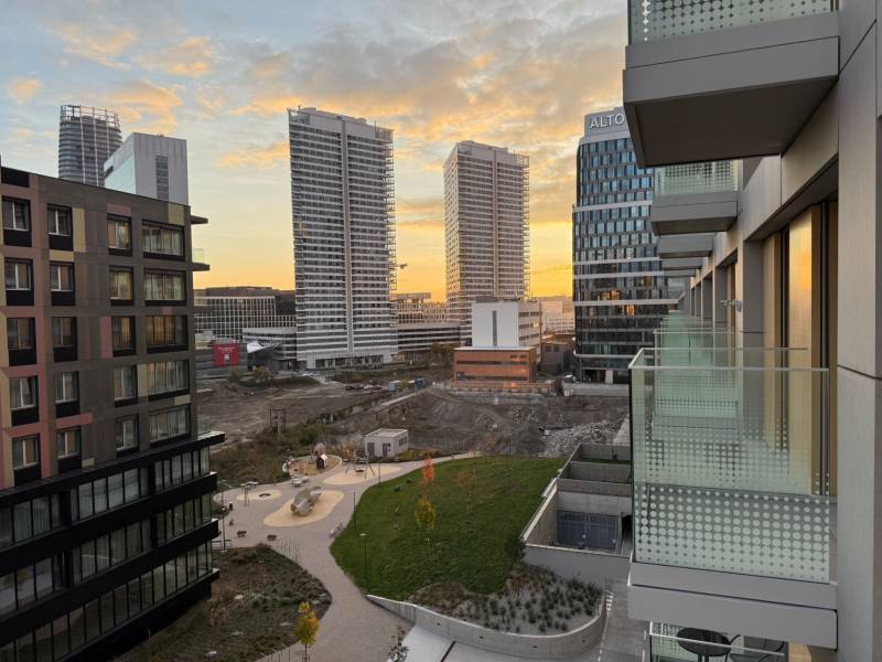 View from the balcony of a two-room apartment of the Bratislava skyline, Bottova Street at sunset.