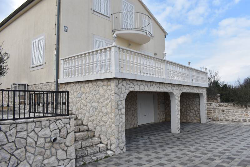 A family house in the town of Pridraga with a stone facade and a spacious terrace.
