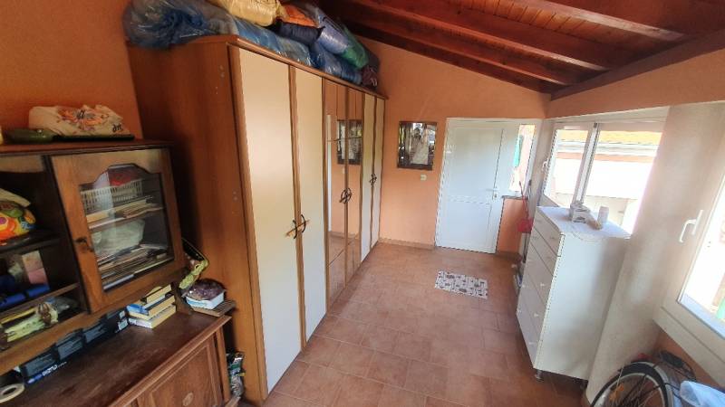 Interior with cabinets and a dresser, floor with wood decor in a family house.