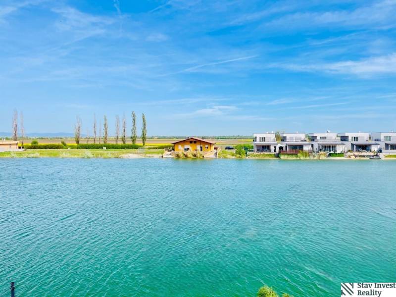 Lake in Senec with modern architecture on residential plots.