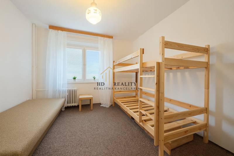 A children's room with a bunk bed and simple furnishings in a 3-room apartment.
