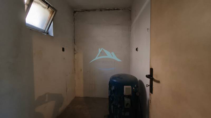 Empty room with a window and a tank in a family house.