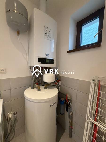 Heating in a family house, boiler and water tank, energy efficiency.