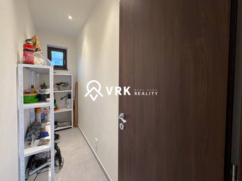 Storage space with shelves and cleaning products in a family house.