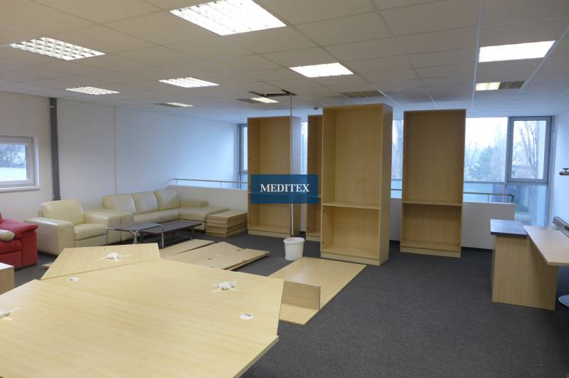 Commercial spaces with a light-colored sofa set, shelves, and tables with a wood decor.