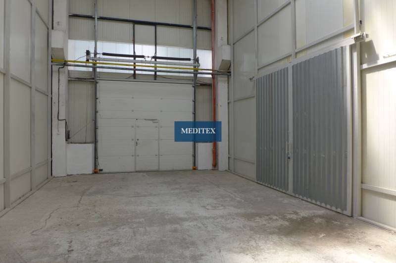 A space with concrete floors and high ceilings in warehouses and halls.