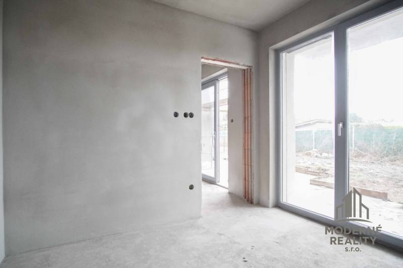 Interior of a family house with sliding doors and unfinished walls.