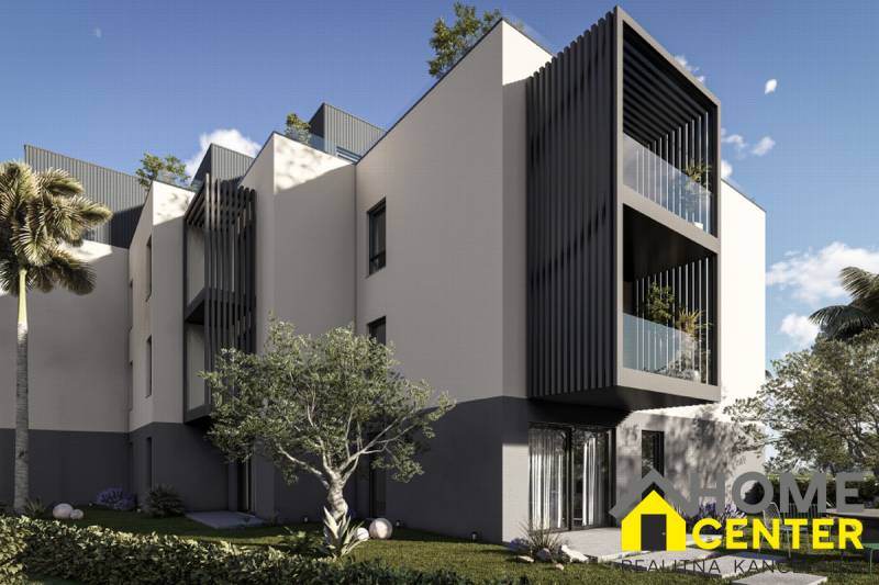 A recreational apartment in Hvar with modern features, palm trees, and green trees.