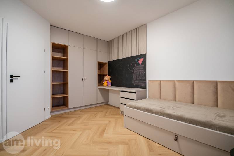 Children's room with a bed, wardrobe, shelves, and a floor with a wooden decor.