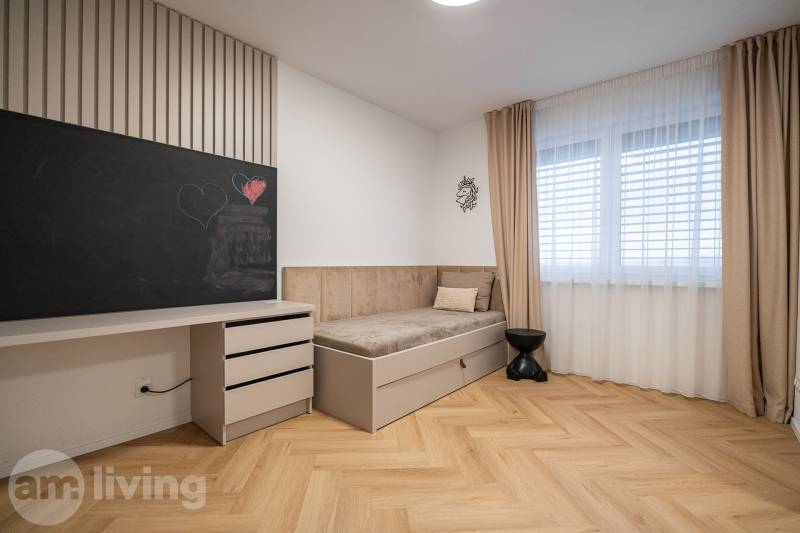 Children's room in a 3-room apartment with a board, bed, and floor with a wooden decor.