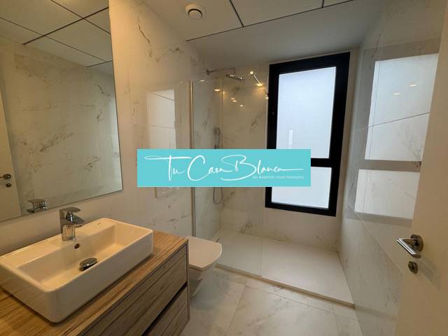 Bathroom with toilet and shower in a 3-room apartment.