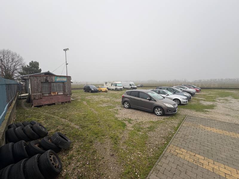Parking lot on Bratislavská Street in Veľký Biel, used for land - housing.