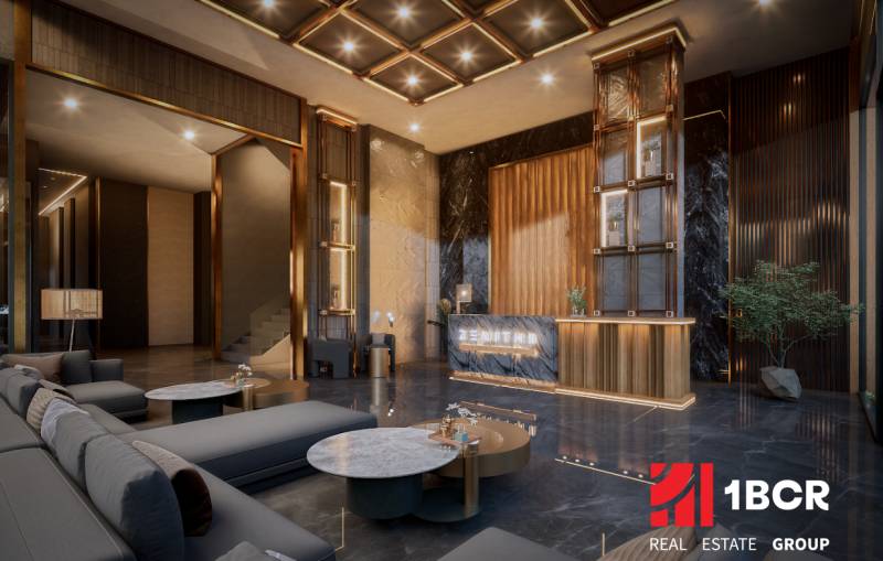 Luxury reception with wood-patterned flooring within the construction of apartments.