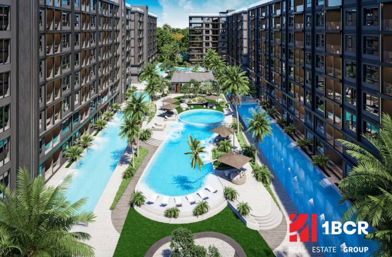 The construction of apartments in Pattaya with swimming pools, terraces, and palm trees creates a tropical atmosphere.