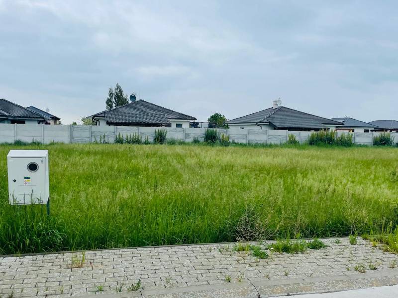 Plots - housing in Hviezdoslavov on Podháj with grassy area and surrounding houses.