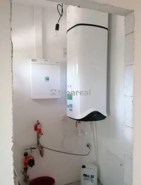 Heating with a boiler and tank in a family house.