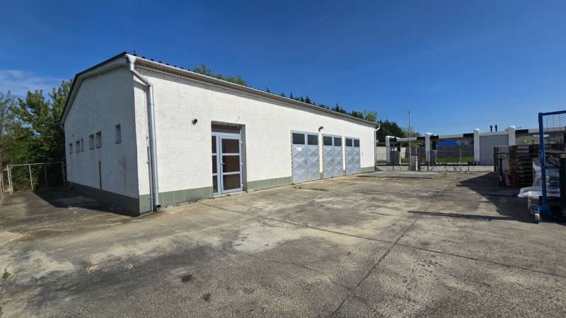 Warehouses and halls in Šaľa with three garage doors and a reinforced adjacent area.