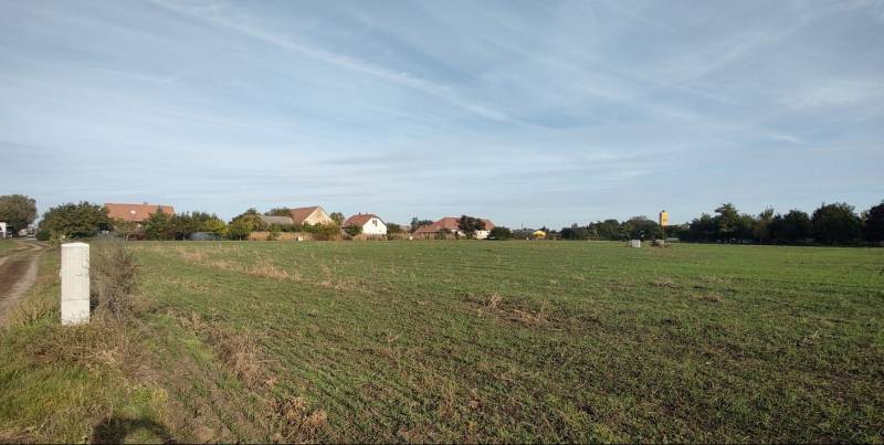 Residential plots in Rastislavice with a view of the village and greenery.