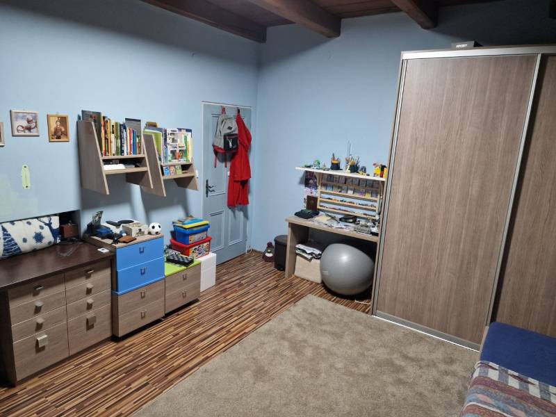 Children's room in a family house with wooden decor and furniture.