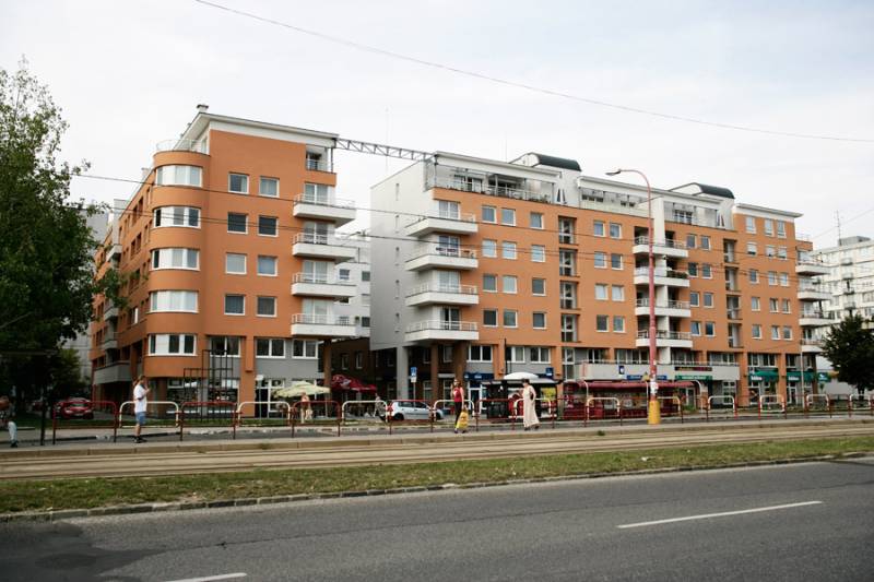 Residential and commercial premises on Komárnická Street, Bratislava - Ružinov, with a tram line.