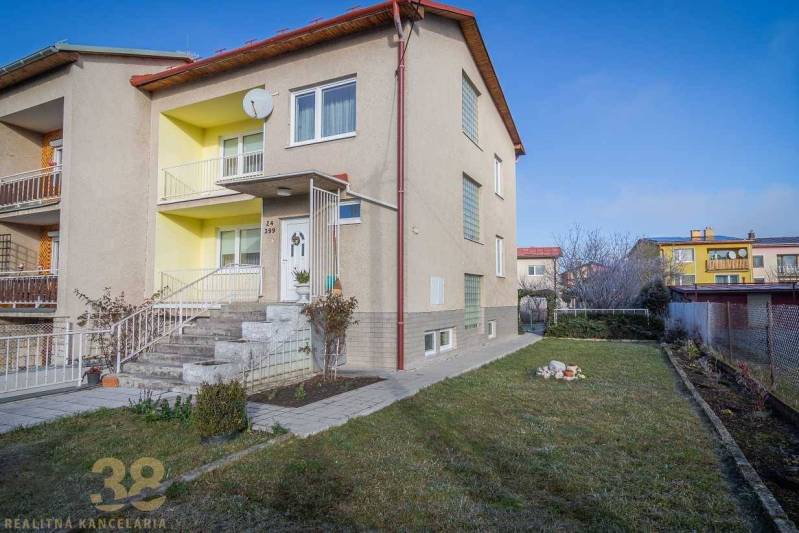 A family house in Poprad with a front garden and stairs leading to the main entrance.