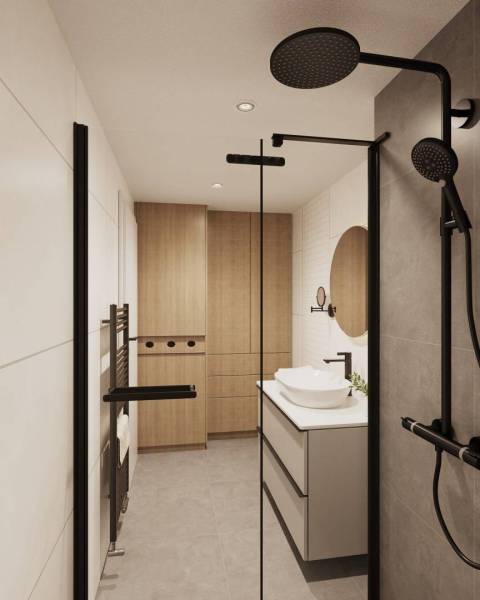 Bathroom with dark shower accessories and wood-patterned flooring.